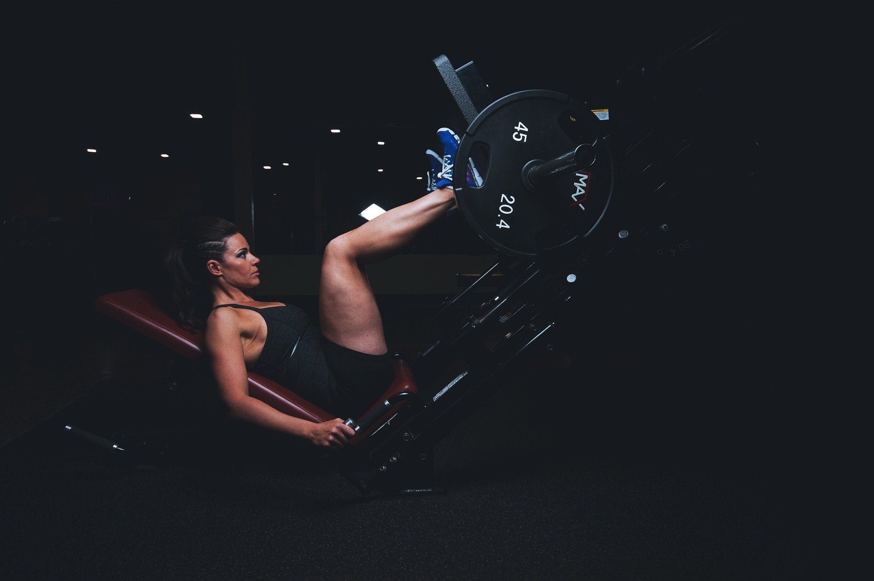 Woman at the gym working out legs