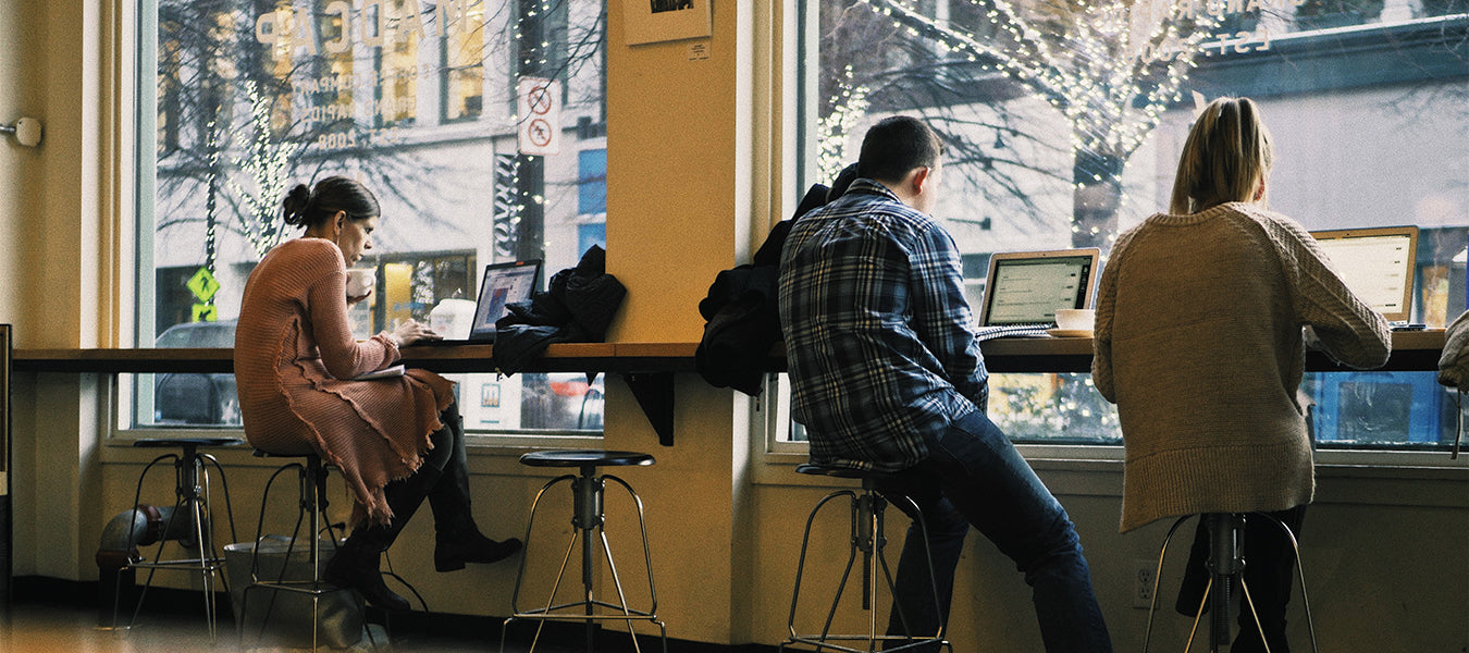 People working remotely from a coffee shop