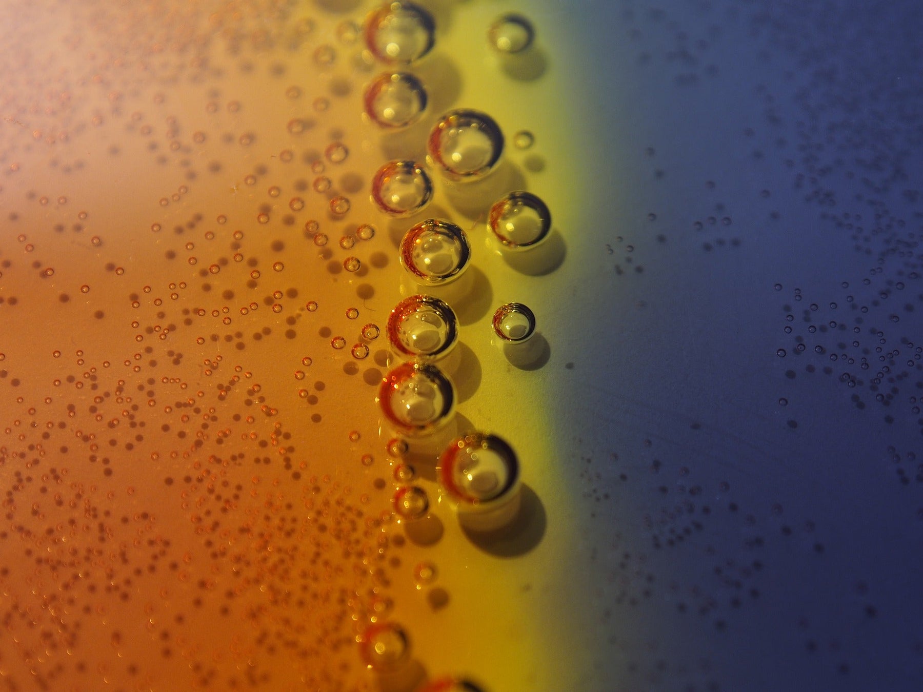 Bubbles in a middle of an orange and blue surface