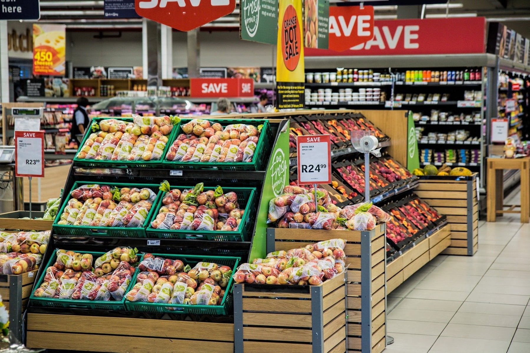 Grocery store showing baskets full of vegetables