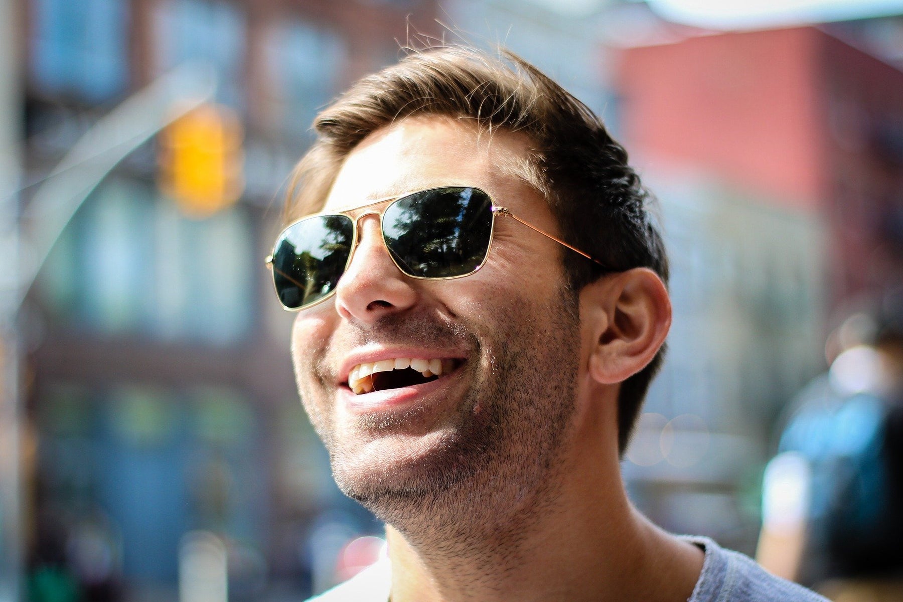 Happy man with sunglasses smiling