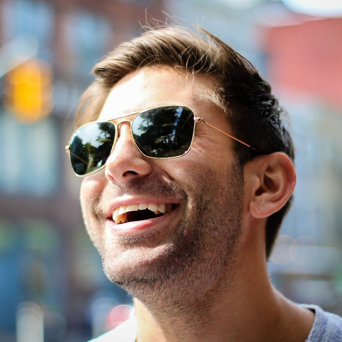 Happy man with sunglasses smiling