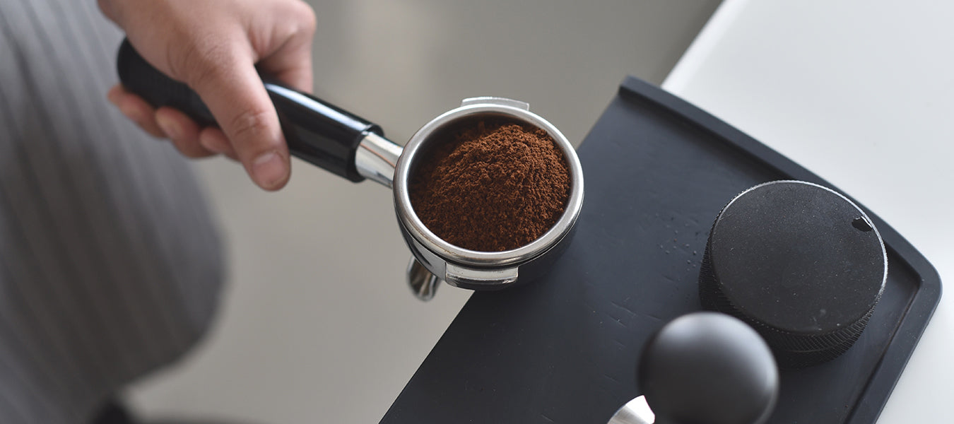Man holding device for making coffee