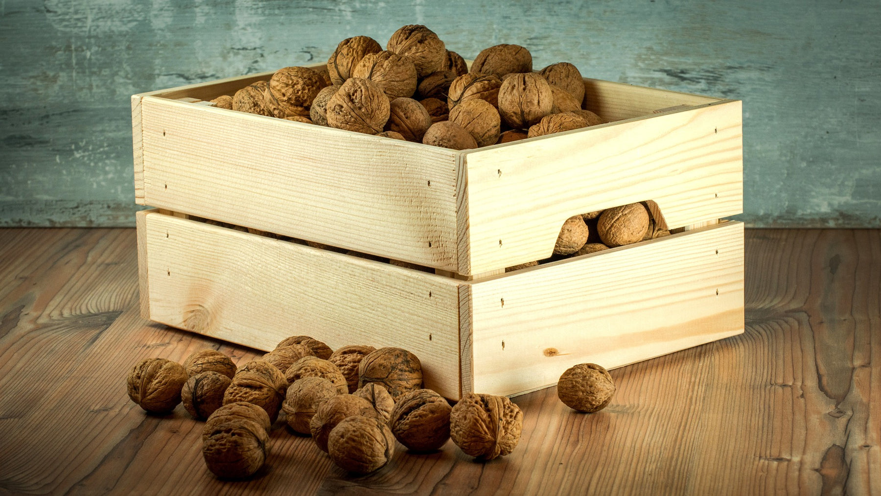 Nuts in a wood container over the floor