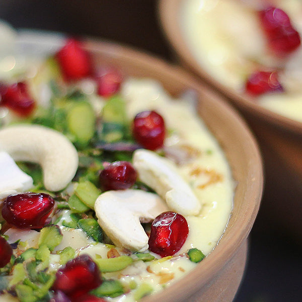 Healthy meal in a bowl with cashew and pomegranate