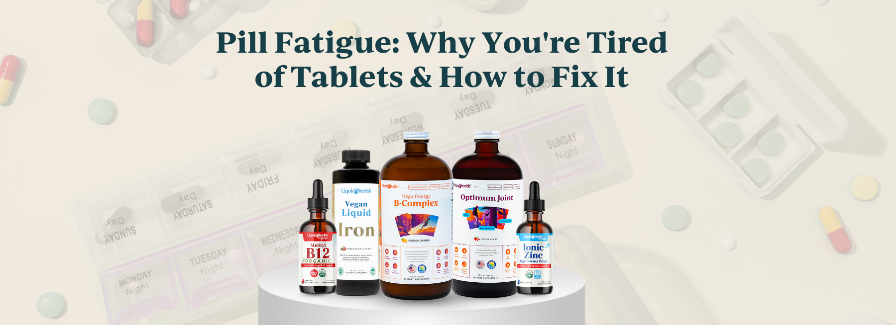 Five Liquid Health bottles on a pedestal, contrasting with faded daily pill organizers in the background.