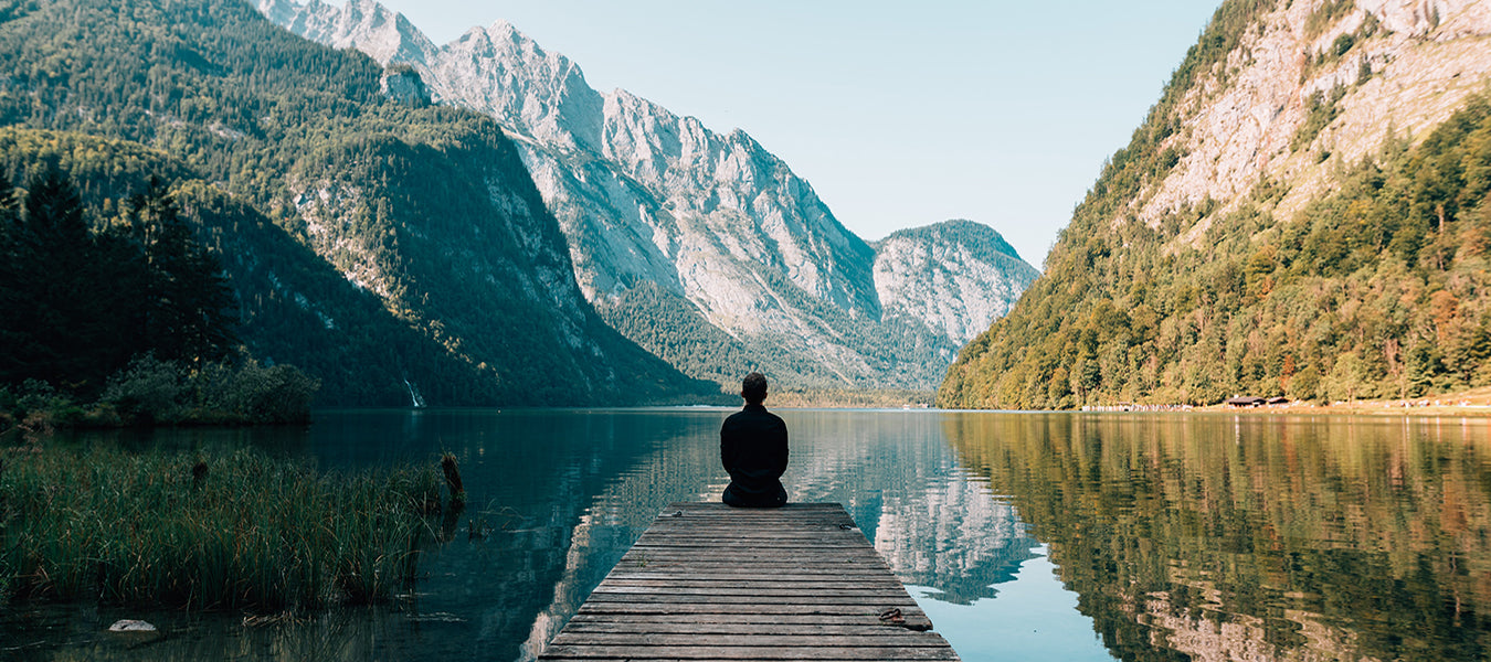 A man meditating in the mountains