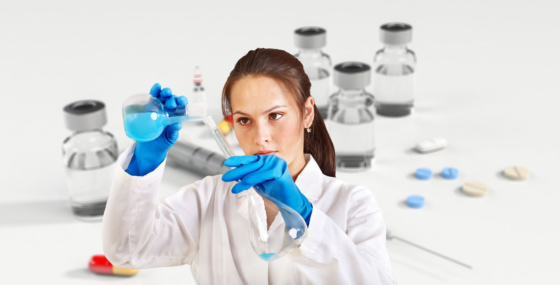 Laboratory woman with blue gloves pouring liquid